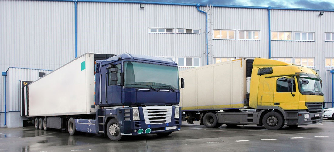 freight-trucks-warehouse